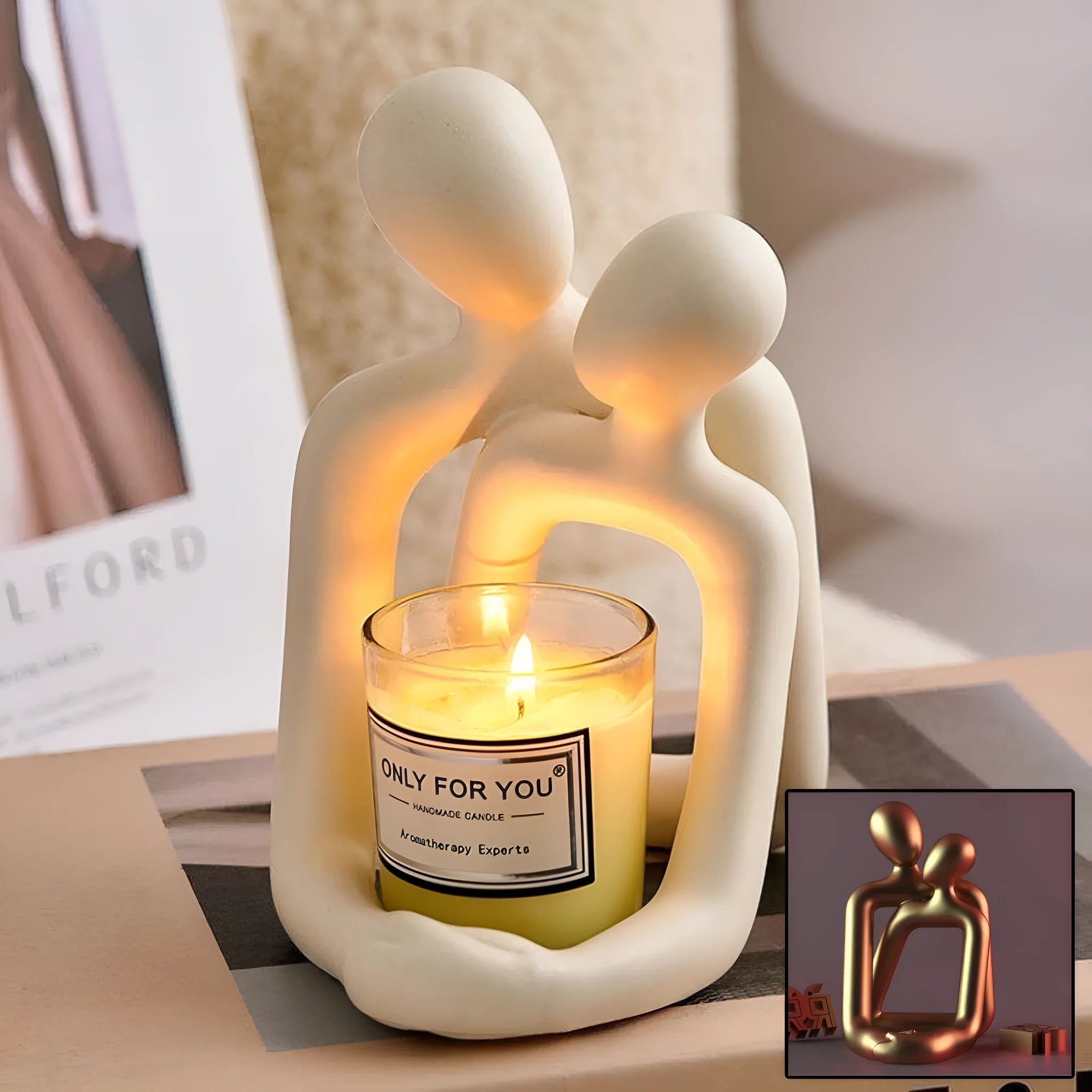 Modern loving couple resin statue in milky white or gold colour on a desk.