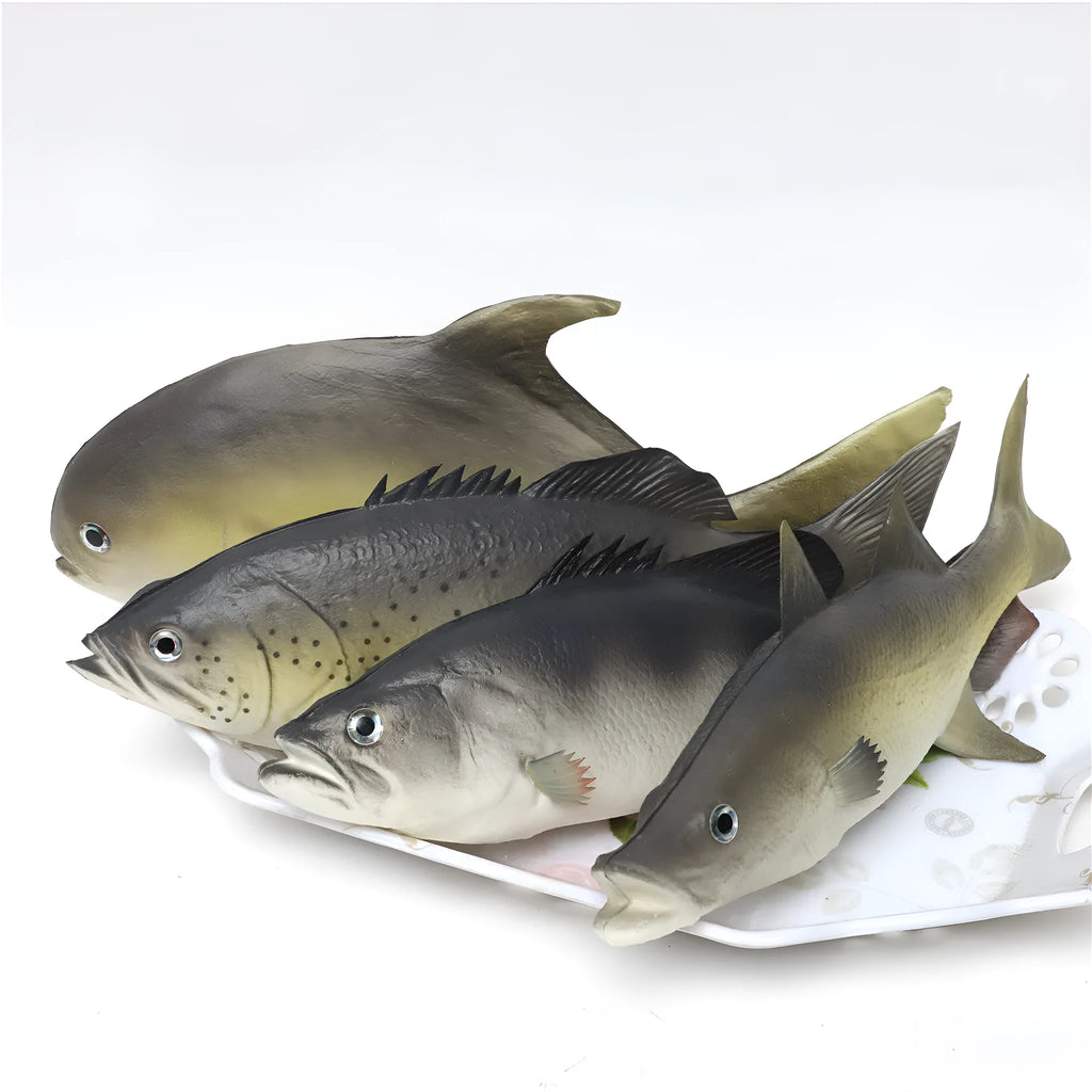 Set of four colourful PU simulated fish model ornaments including tuna and flower fish on a white background.