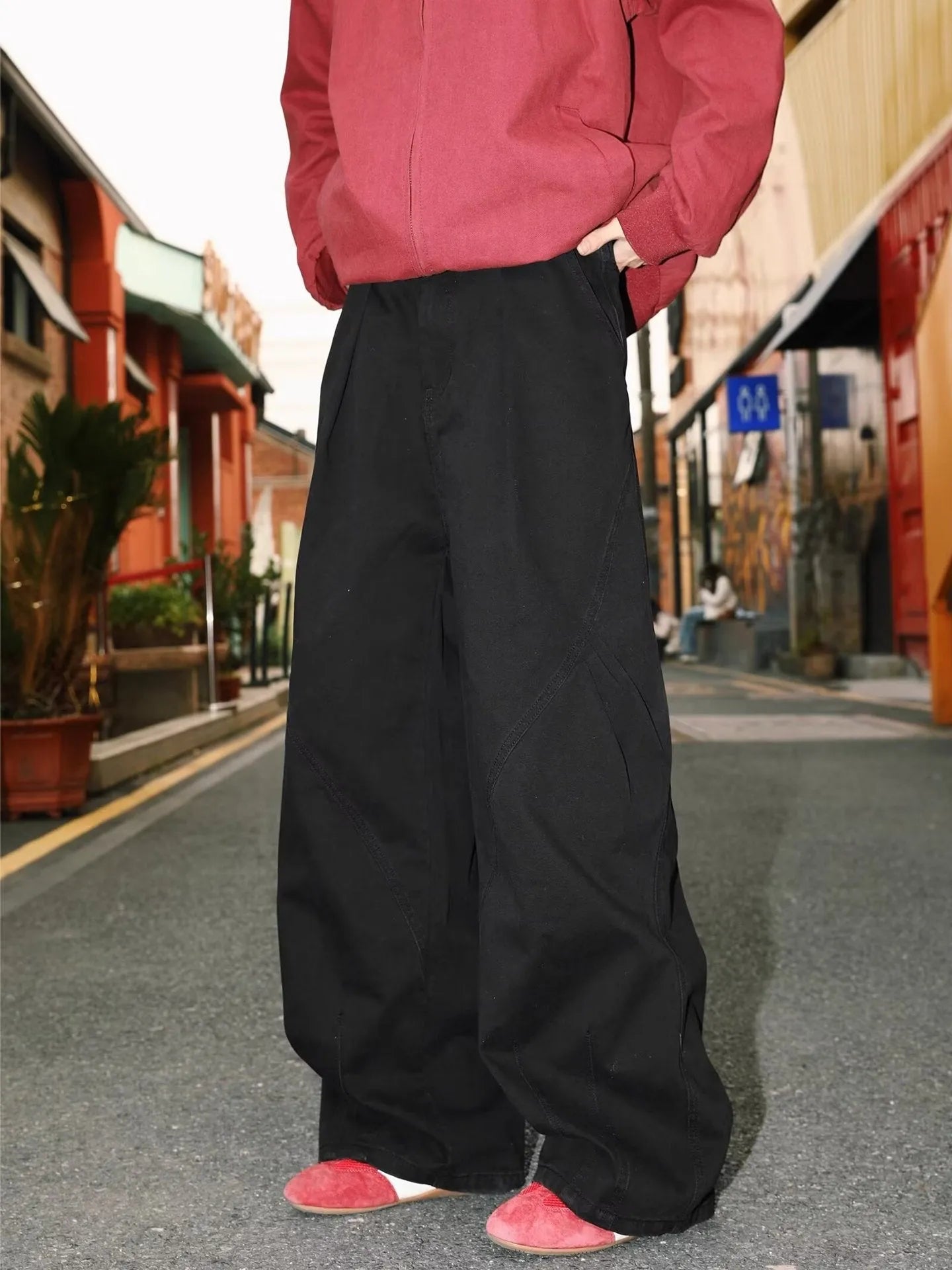 Men's loose-fit pleated trousers in a striped pattern, shown in apricot colour with a straight leg.