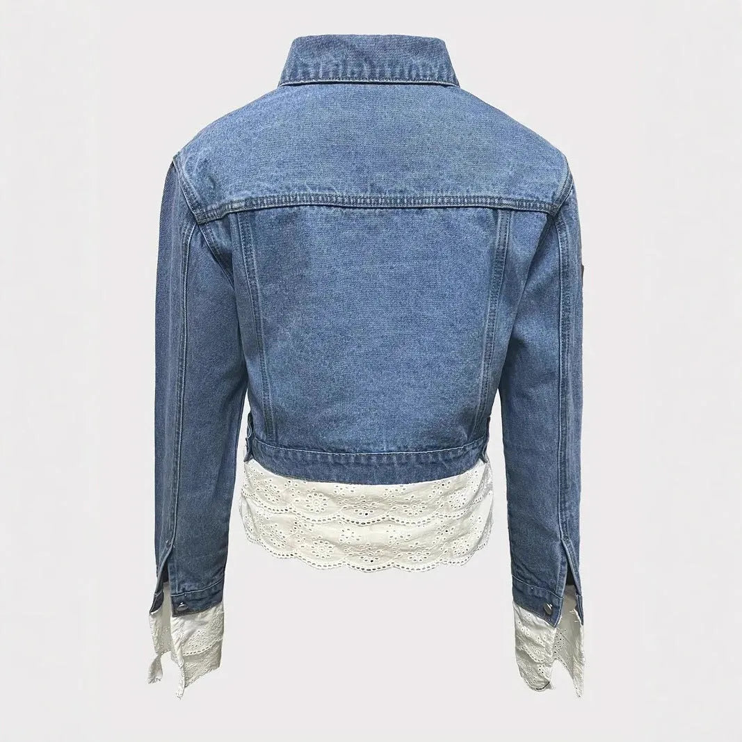Blue women's denim jacket with lace stitching detail, shown on a hanger.