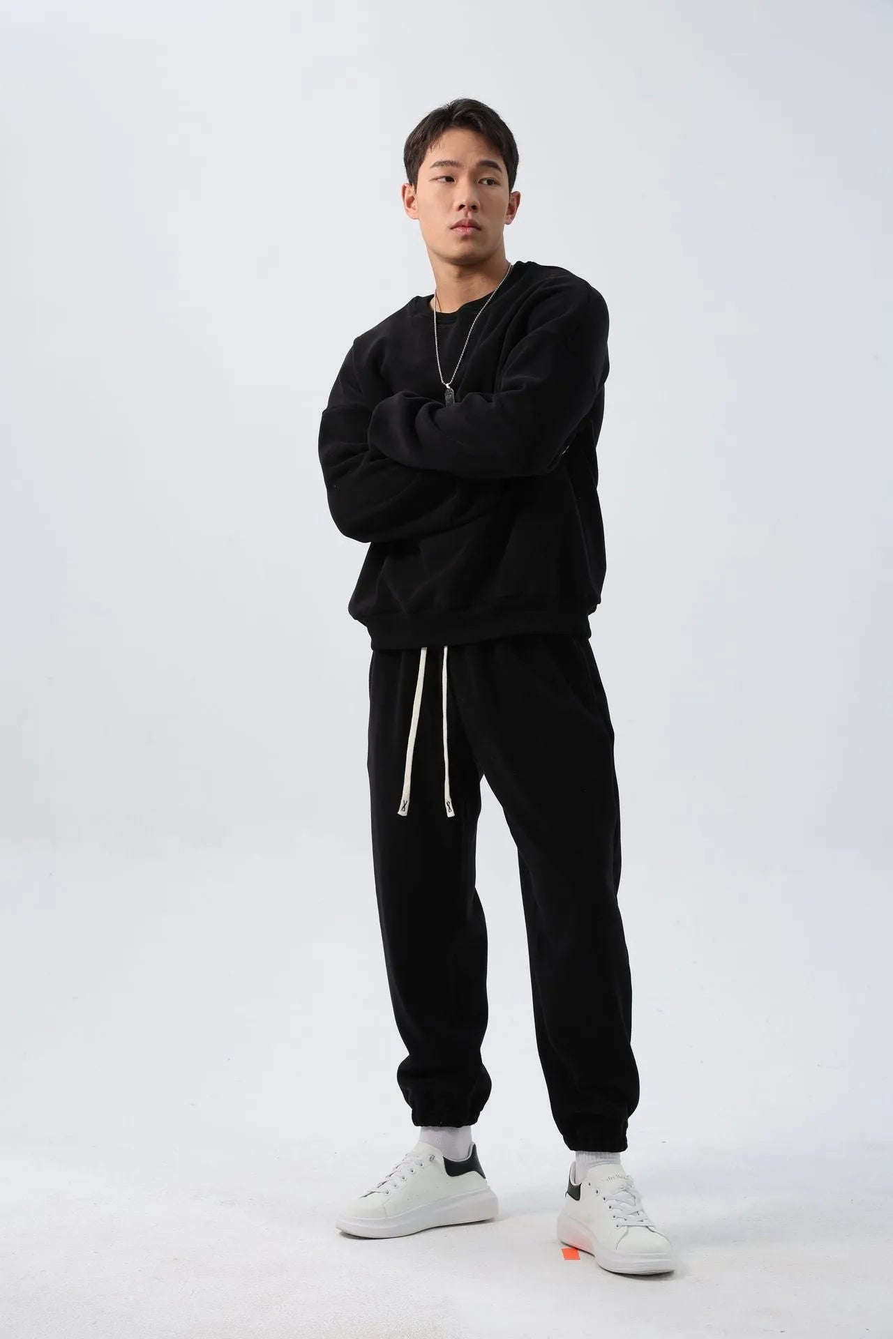 Men's polar fleece sports suit set showing crew neck top with long sleeves and matching padded trousers in winter colours