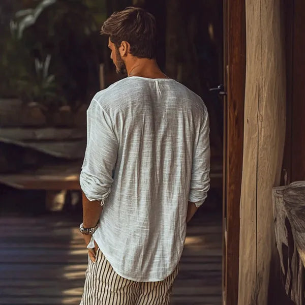 Beige long-sleeved V-neck slim fit t-shirt on a hanger.