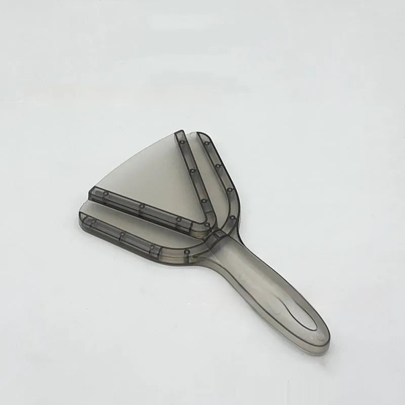 Red adjustable telescopic can and bottle opener with non-slip handle on a kitchen counter.
