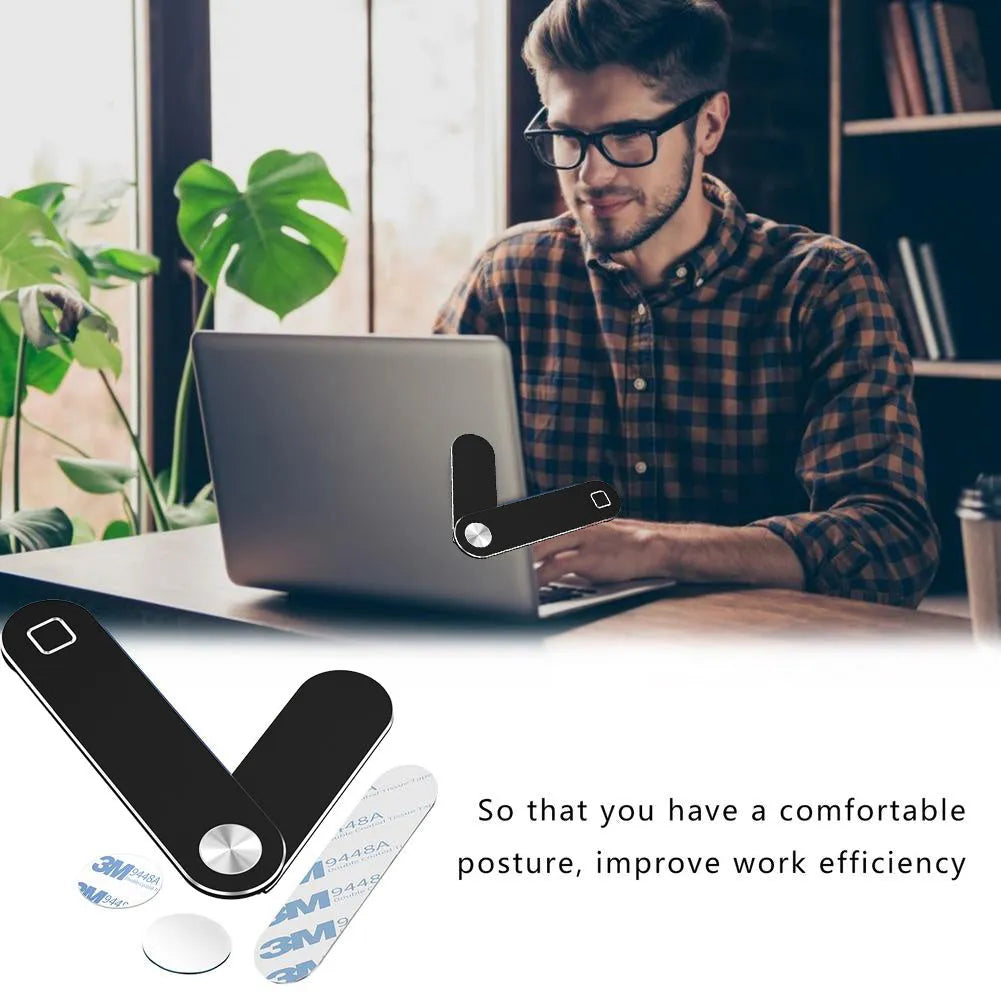 Black aluminium laptop phone holder with magnetic mount attached to laptop side displaying smartphone