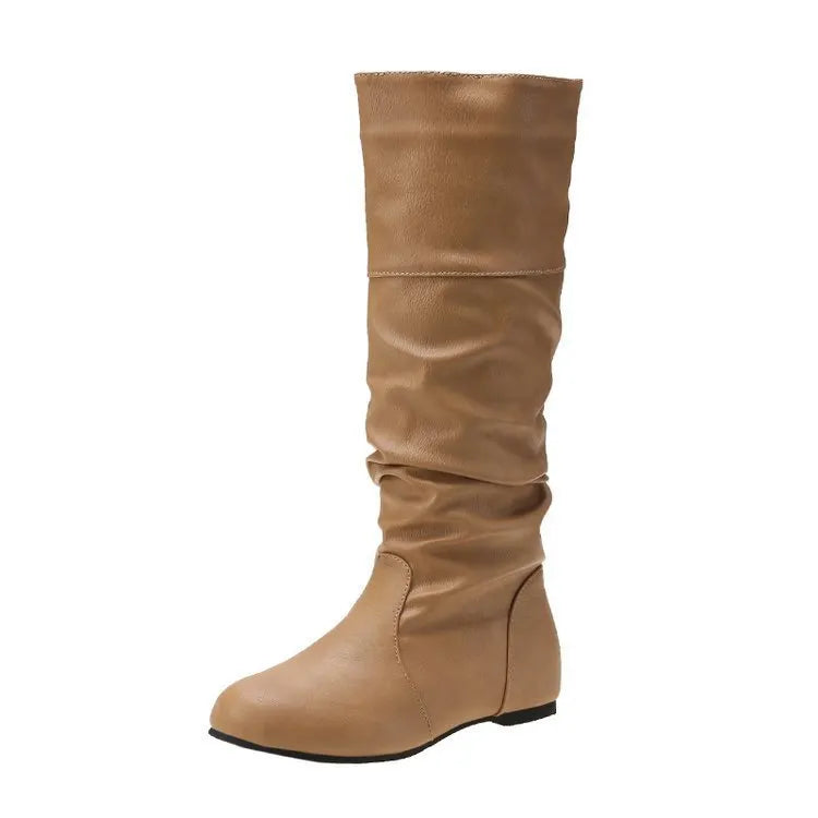 Women's flat slip-on long boots in black with round toe and high cylinder shaft, on a rubber sole.