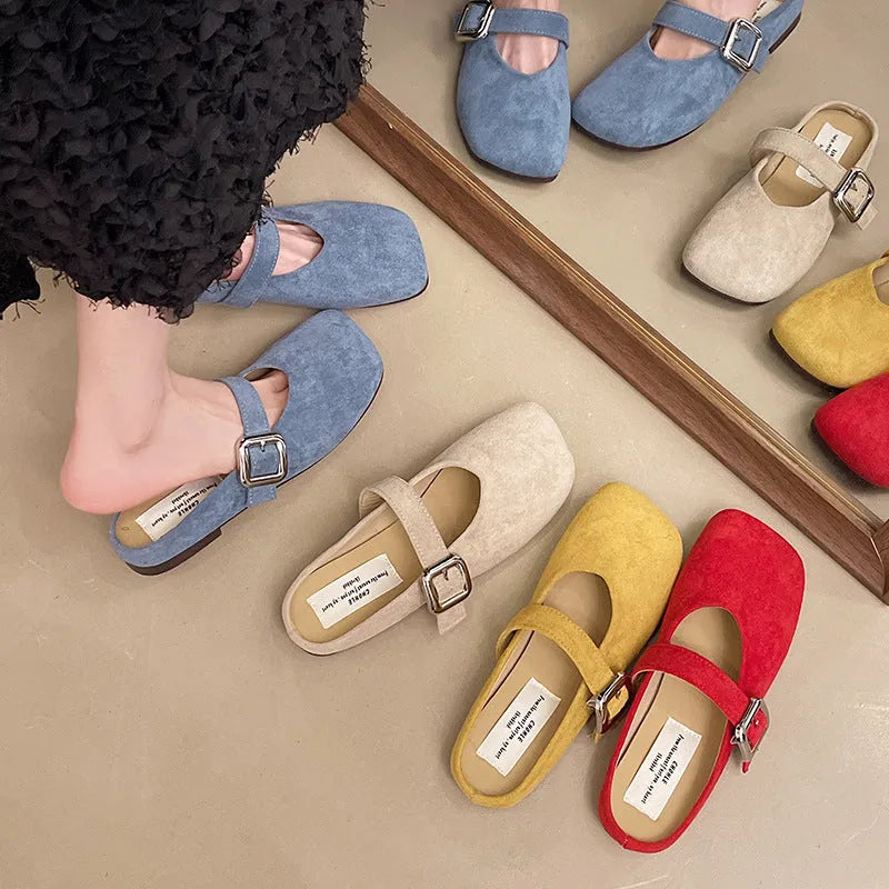 Women's flat apricot coloured slippers with a square toe, PU leather upper, and a dark rubber sole.