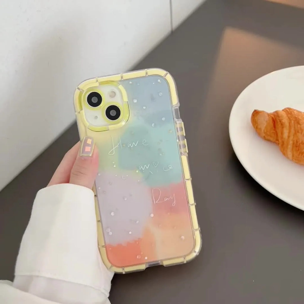 Minimalist iPhone 14 silicone case with a yellow contrast colour edge on a white background.