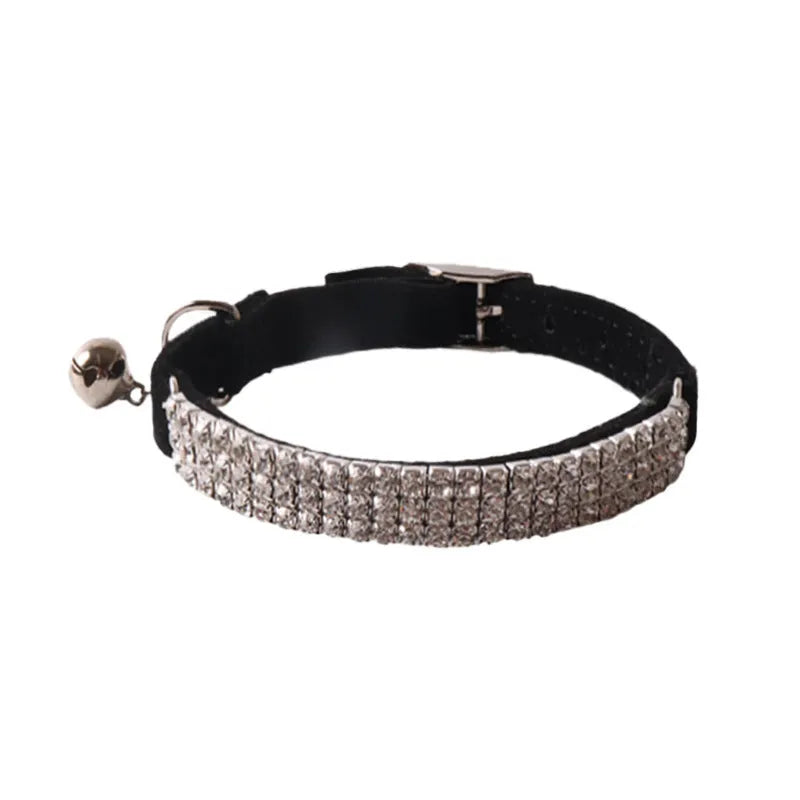 Soft pink flocked cat collar with an elastic section and silver buckle on a 1.0cm wide, 28cm long band.