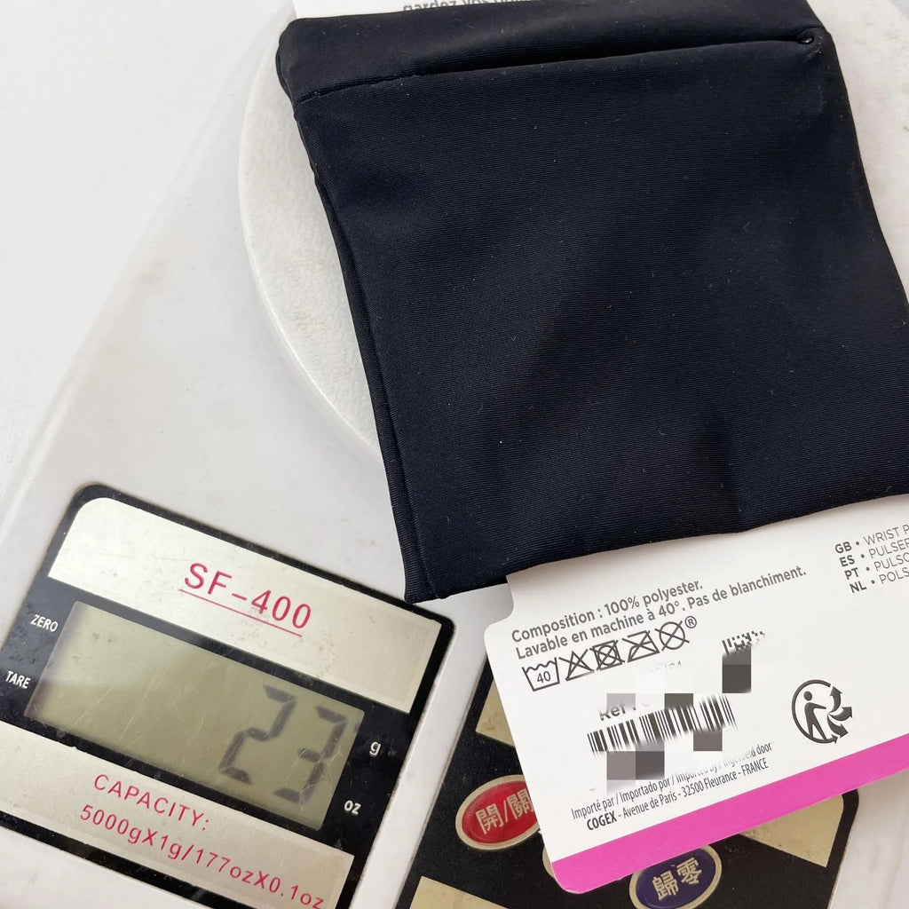 Black wrist bag armband sleeve with strap, showing 10cm by 10.5cm front pocket for a mobile phone.