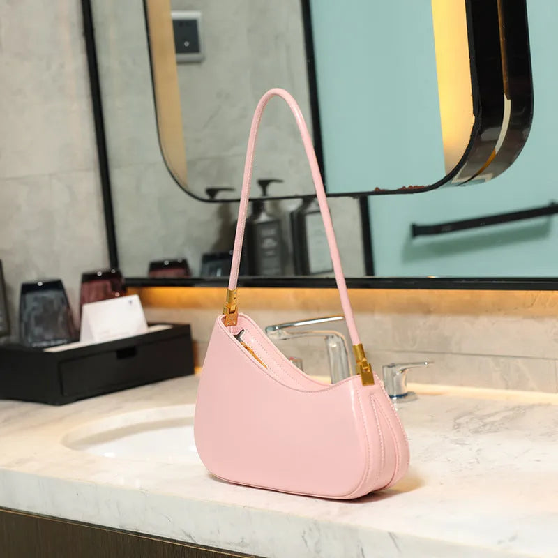 Retro oval women's underarm bag in PU leather with single shoulder strap shown in multiple colour options