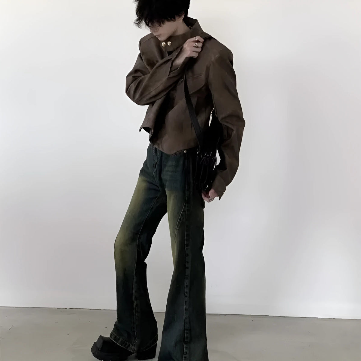 Men's retro brown PU leather short coat with long sleeves and tight fit, shown in casual style.