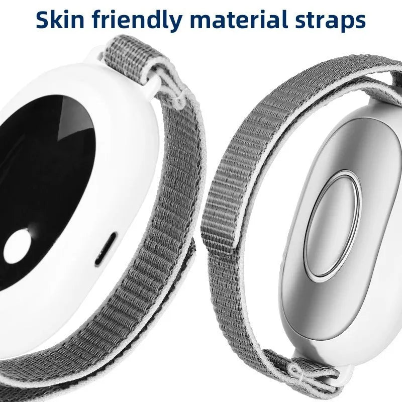 White handheld sleep aid remote control device with charging cable and wristband.