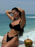 Women's black nylon two-piece bikini set in sizes S, M and L for swimming and wading
