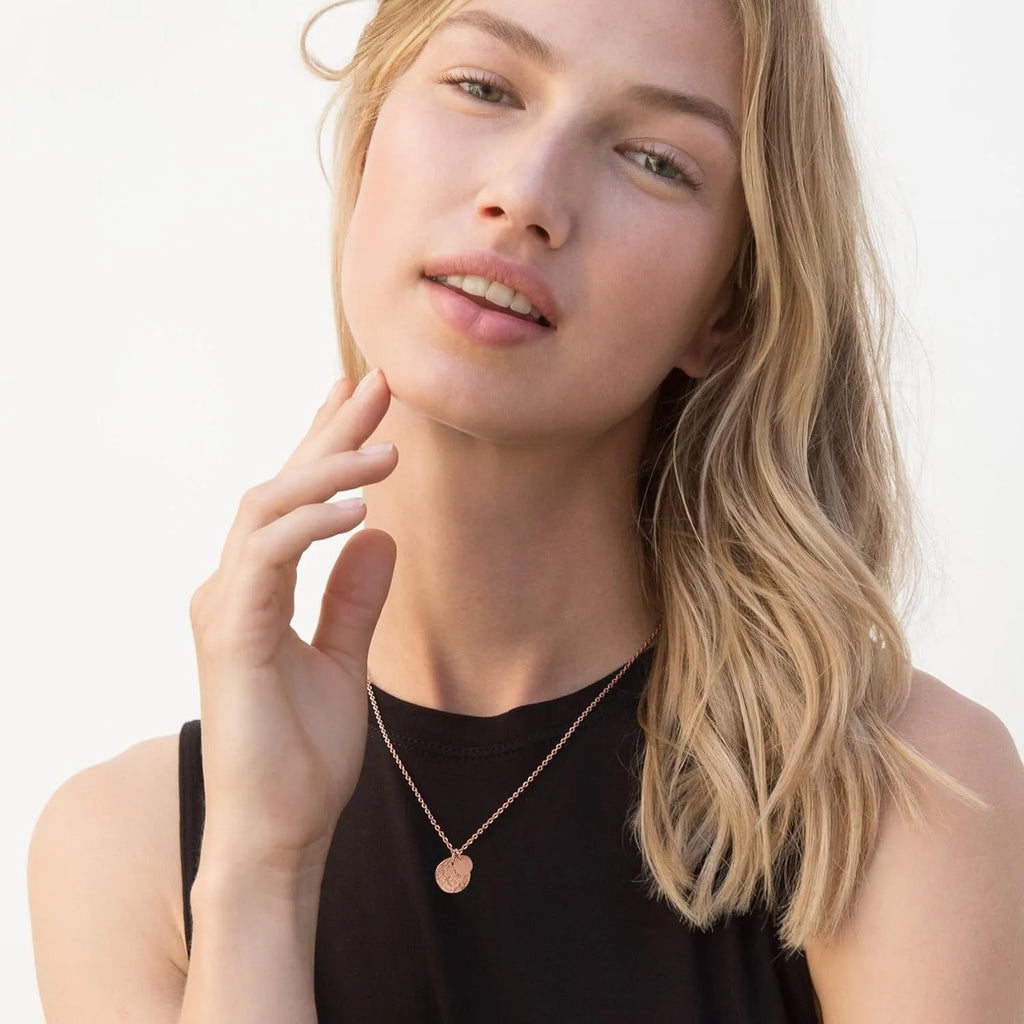 Round coin pendant necklace in gold finish on white background, adjustable 41-50cm stainless steel side chain