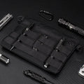 Black Oxford cloth military style outdoor carry bag measuring 18 by 3.5 centimetres