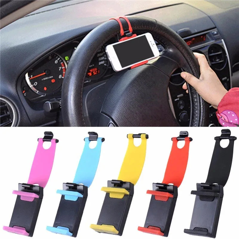 Black universal steering wheel phone holder clip mounted on a car steering wheel, holding a smartphone.