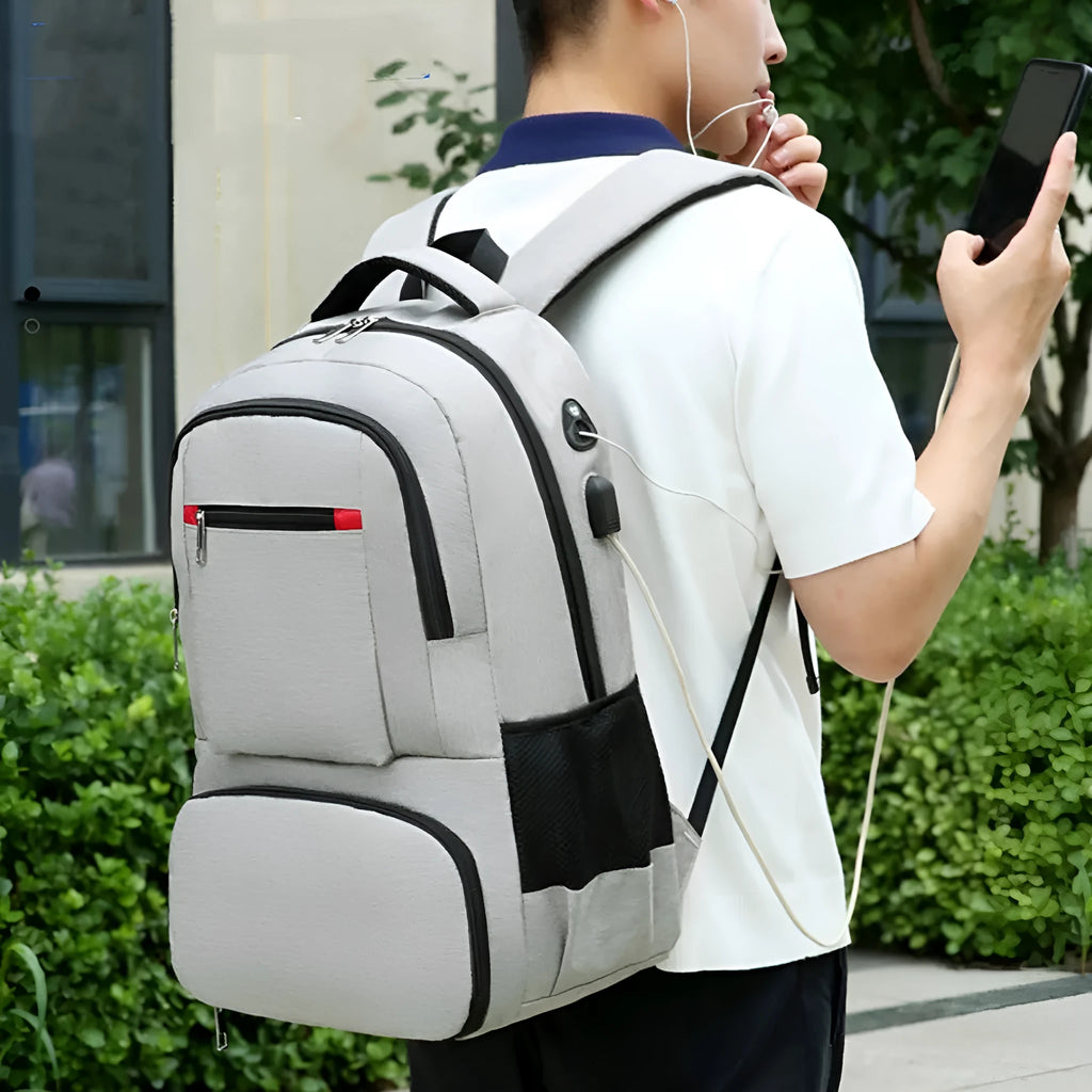 Insulated oxford cloth backpack in light grey showing curved shoulder straps and dry-wet separation compartment.