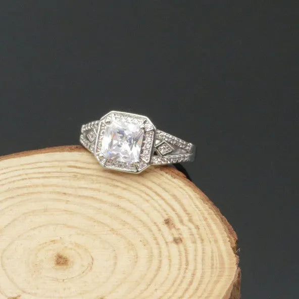 Geometric women's zircon ring with hollow design and platinum-colour finish shown from multiple angles