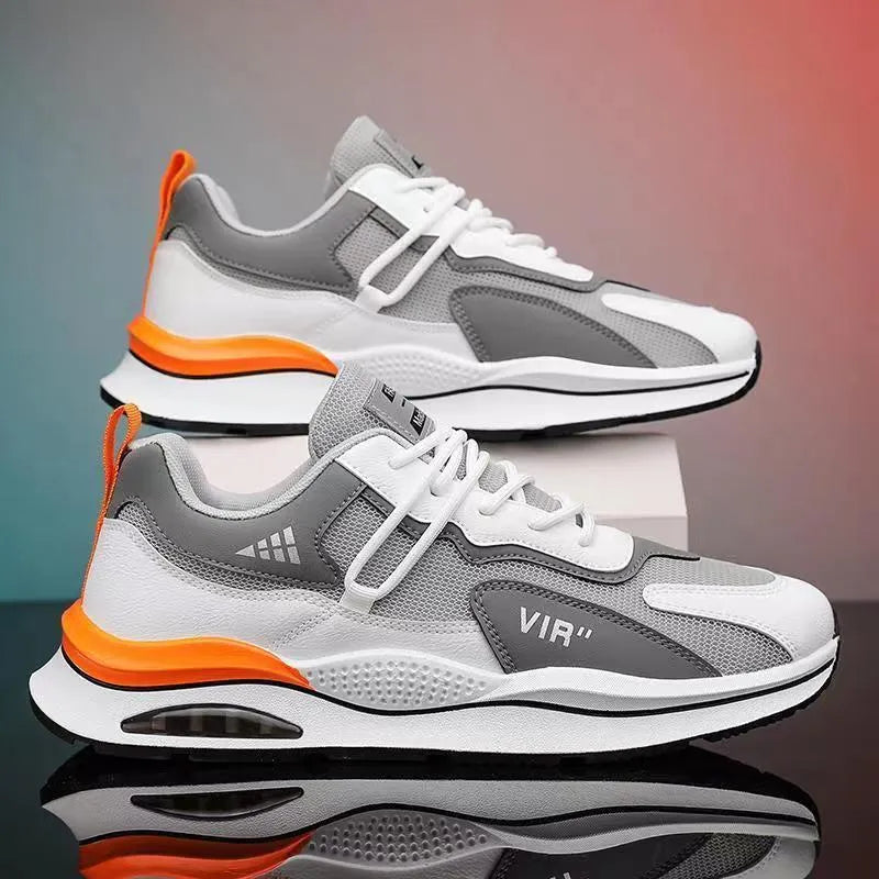 Men's grey breathable mesh running shoes with a round toe and EVA sole on a white background