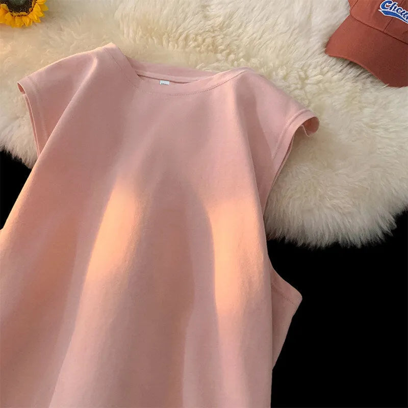 Men's loose fit solid colour cotton tank top shown in a selection of available colours and sizes.