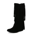 Women's suede knee-high boots with tassel detail and a chunky waterproof platform sole