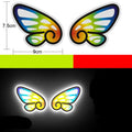 Pair of diamond reflective warning stickers for cars and motorbikes, showing sample designs like a dragon or cat, approx 9 cm by 5 cm.