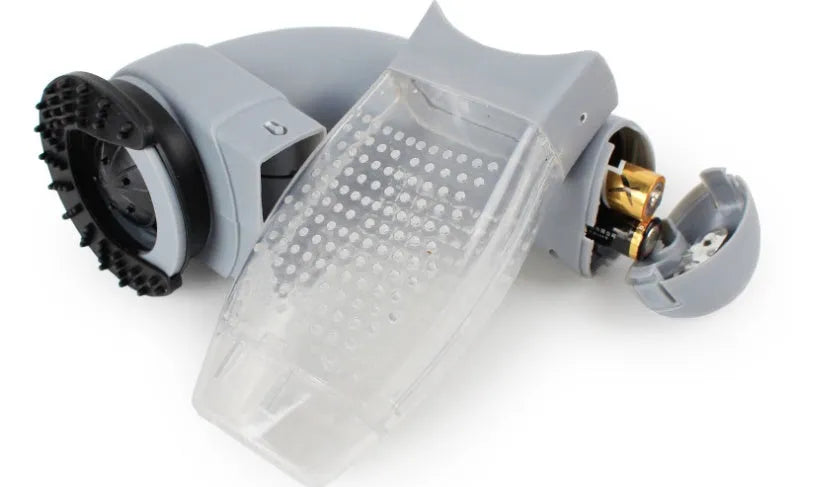 Grey portable pet hair vacuum cleaner with soft rubber head for grooming dogs and cats.