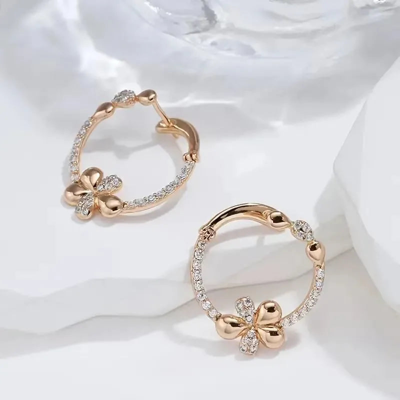 A pair of women's round geometric ring earrings in copper with an electroplated EK13286-FD-01 colour finish.