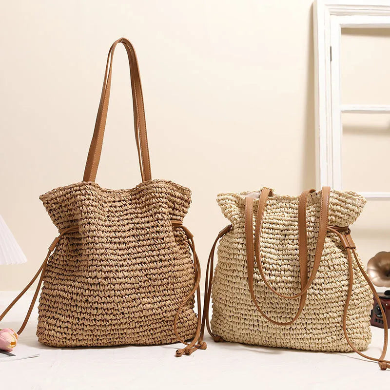 Large straw drawstring shoulder bag with polyester lining and mobile phone pocket in beige or coffee