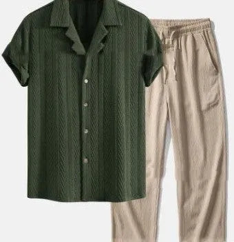 Man wearing a loose short sleeve shirt and matching trousers from the milk silk summer suit set.