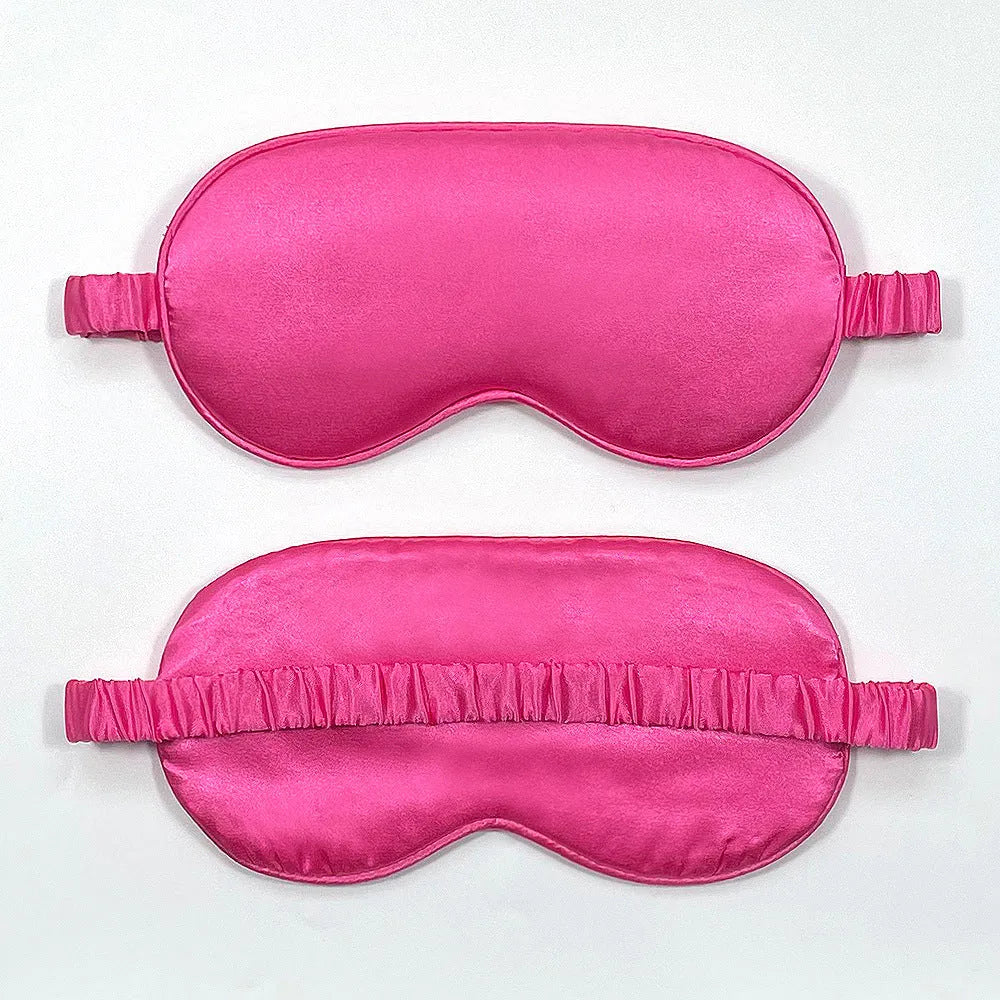 Rayon satin double-sided sleep mask in a selection of solid colours on a white background.