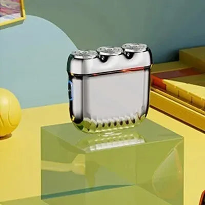 A mini three-head magnetic electric shaver in gun colour, orange, green, or blue, shown with its floating cutter head.