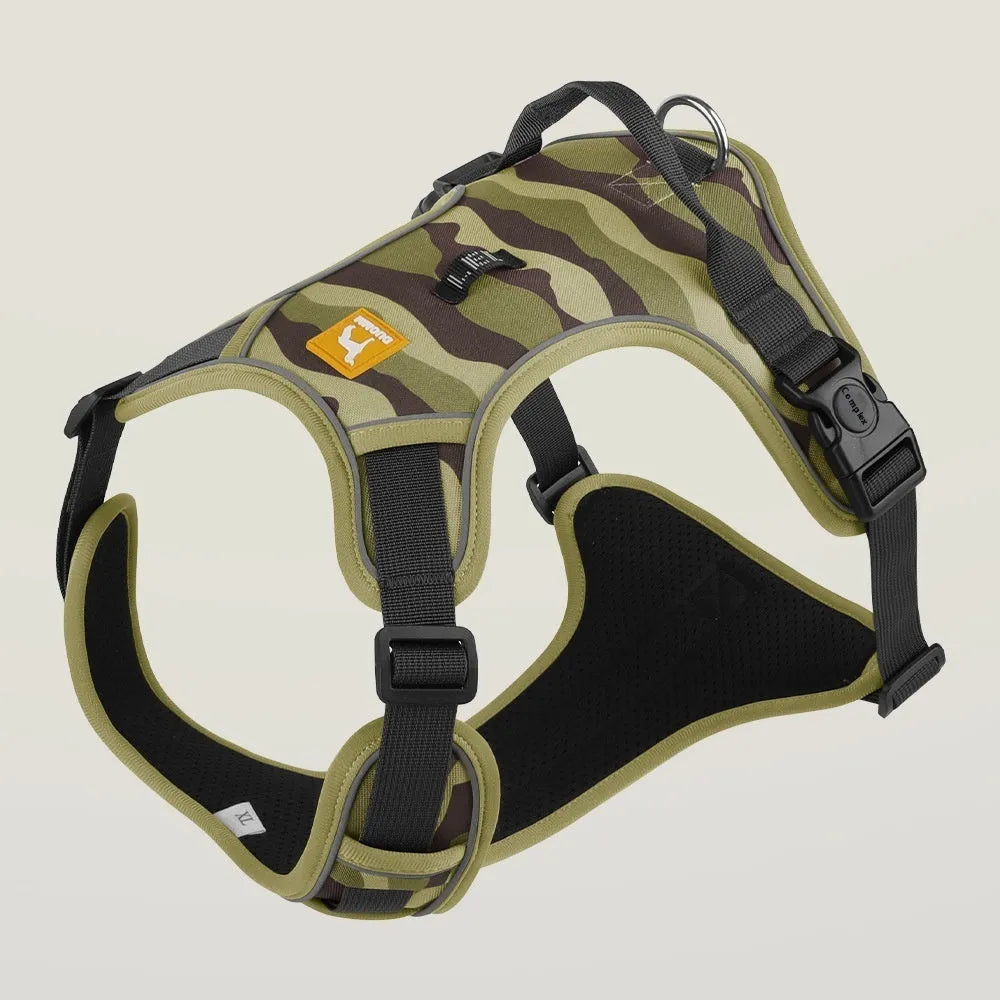 Reflective orange dog harness with chest and back rope attachments and a hand-holding lead.