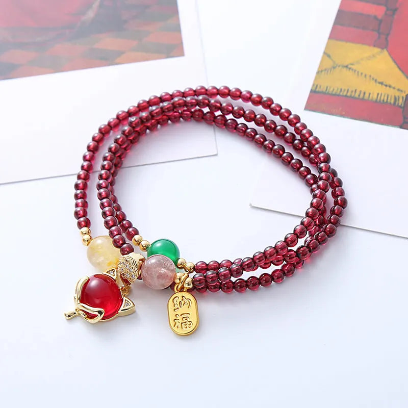 Purplish red garnet crystal fox bracelet with adjustable rope fastening for women