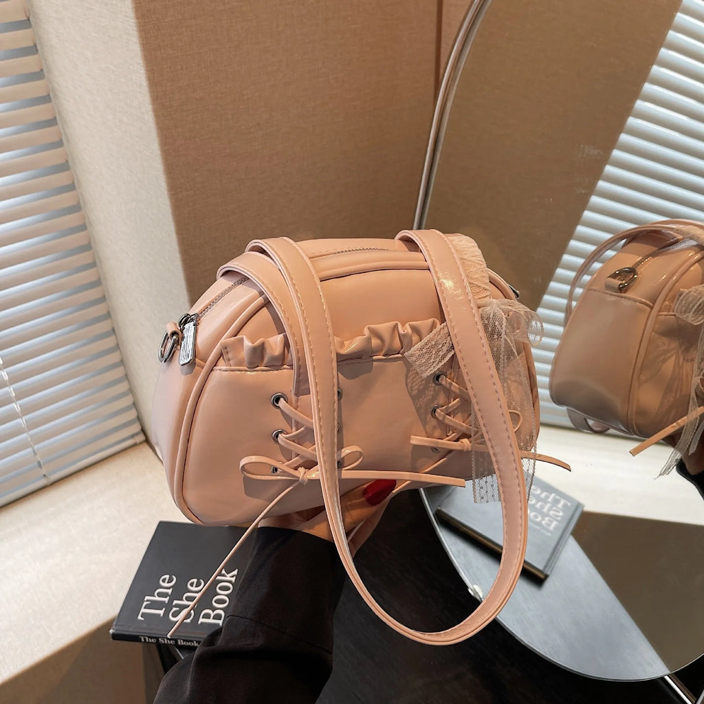 Women's bandage bow handbag in PU leather with shoulder strap and sewing thread detail