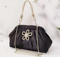 Women's diamond quilted crossbody messenger bag in soft polyester with chain detailing and document compartment