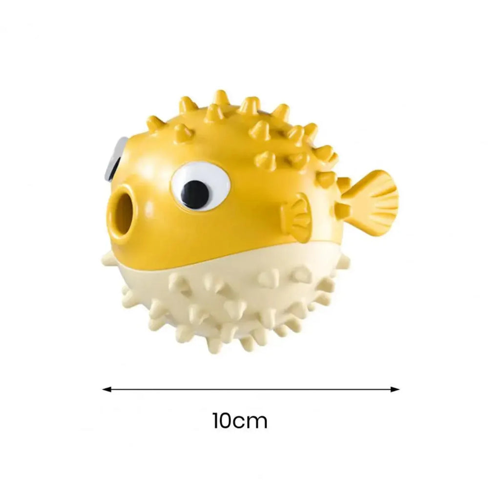Yellow vinyl fish-shaped dog chew toy with textured surface and squeaker inside.