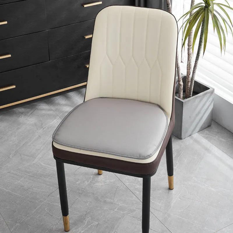 Leather horseshoe-shaped seat cushion with non-slip base in beige colour