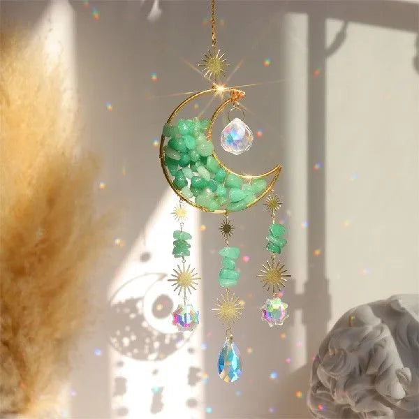 K9 crystal moon-shaped car pendant hanging, showing reflective surface and colour options.