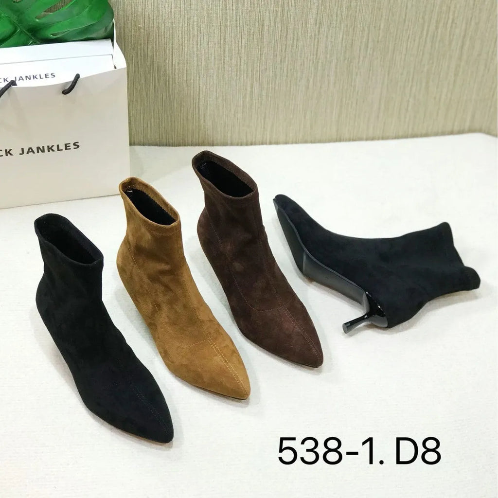 Black pointed toe women's ankle boots with a stiletto heel on a mid-calf shaft.