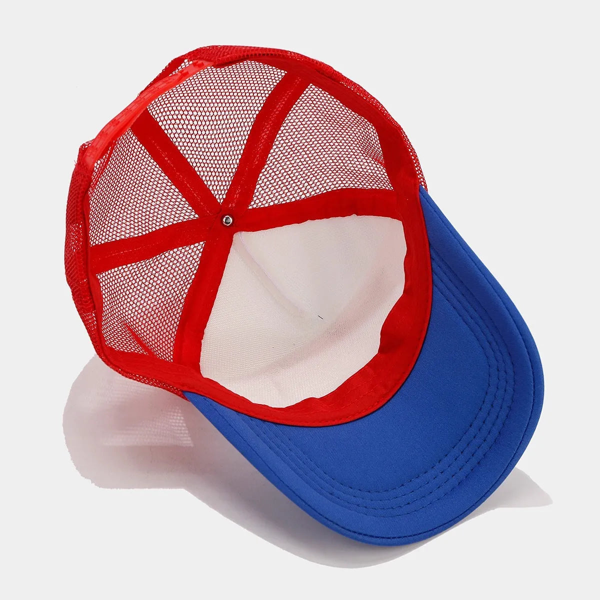 Red and blue contrasting mesh baseball cap with adjustable strap and dome crown