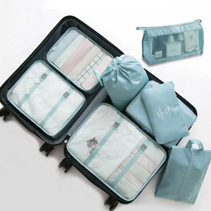 8-piece set of nylon packing cubes in various colours for travel storage of clothes, shoes, and toiletries