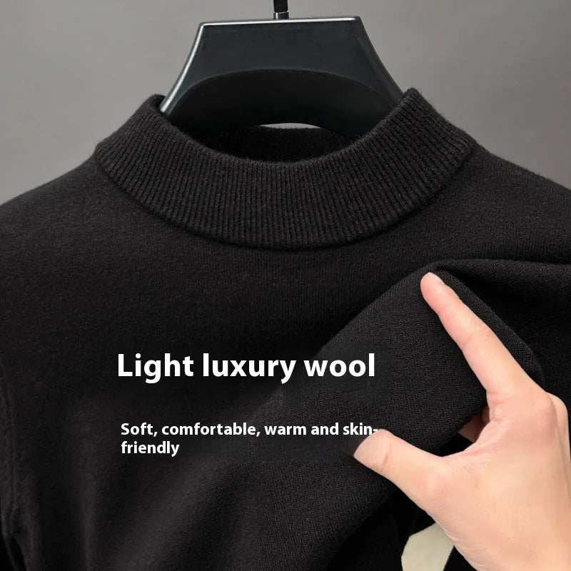 Men's fine wool half turtleneck sweater in a solid colour, showing long sleeves and regular fit.