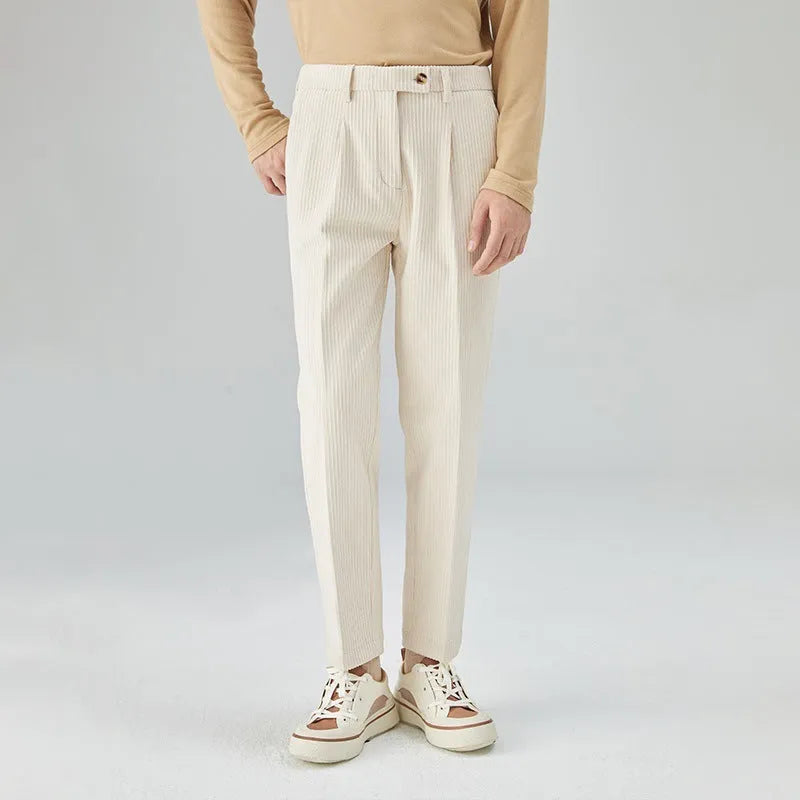 Men's straight-leg corduroy trousers in black, beige, and brown grey colours showing loose fit and textured fabric