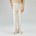 Men's straight-leg corduroy trousers in black, beige, and brown grey colours showing loose fit and textured fabric