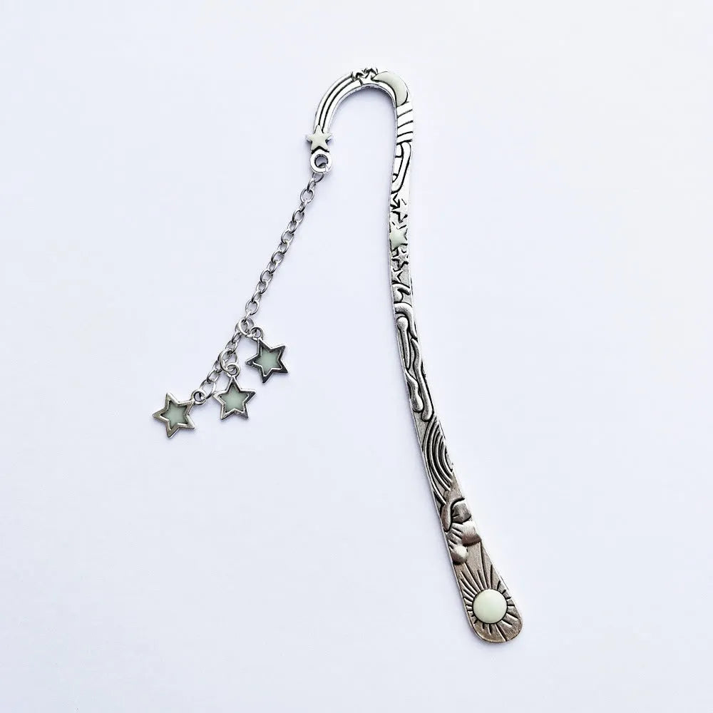 Retro five-pointed star metal bookmark with fluorescent detail in ancient silver or bronze celestial design