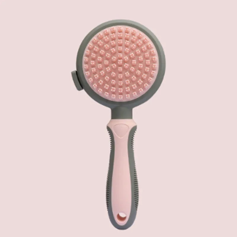 Green and pink two-sided silicone pet grooming brush with slicker brush and massage head on a white background