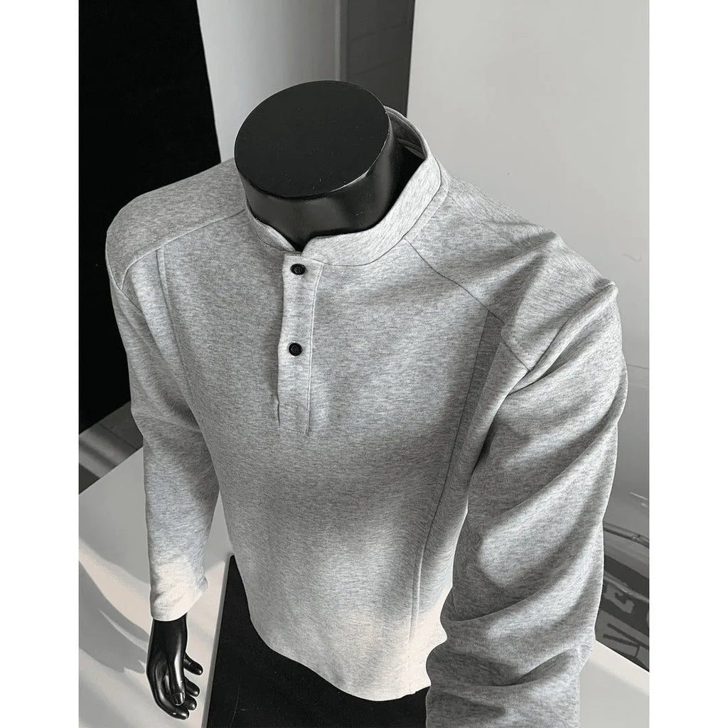 Men's grey asymmetric patchwork polo shirt with a stand-up collar, long sleeves, and a loose fit.