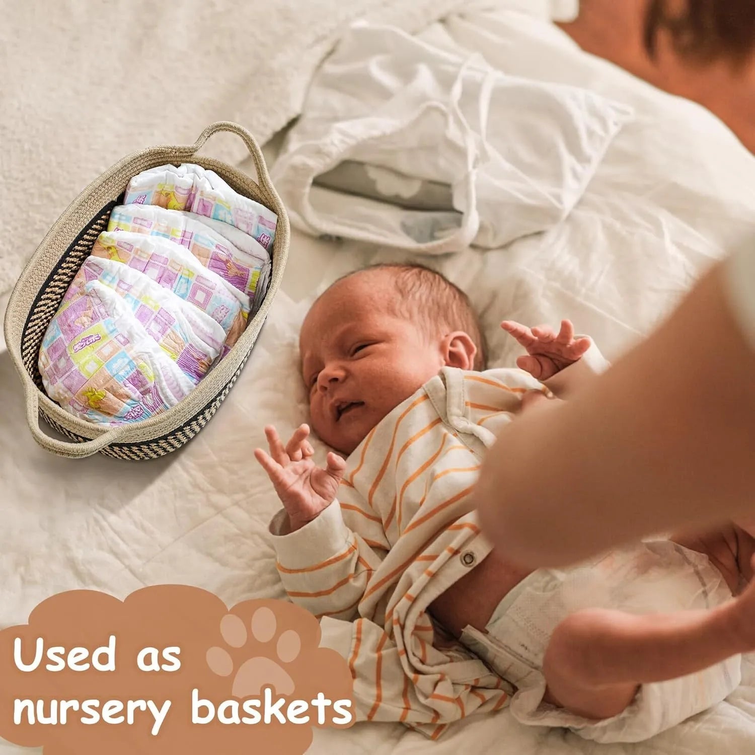 Light beige handmade cotton rope woven storage basket with handle on a wooden base.