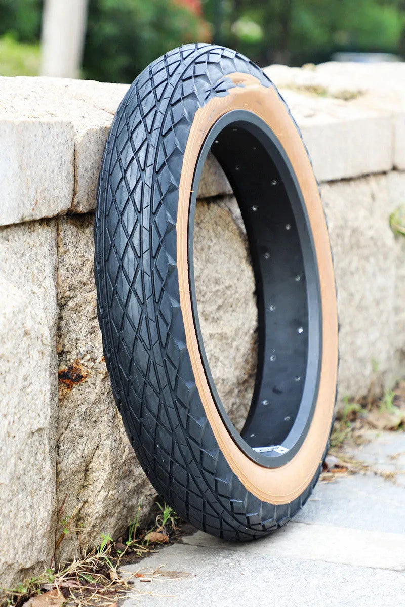 Brown-edged 20x4.0 inch rubber replacement tyre for snowmobiles and electric beach carts.